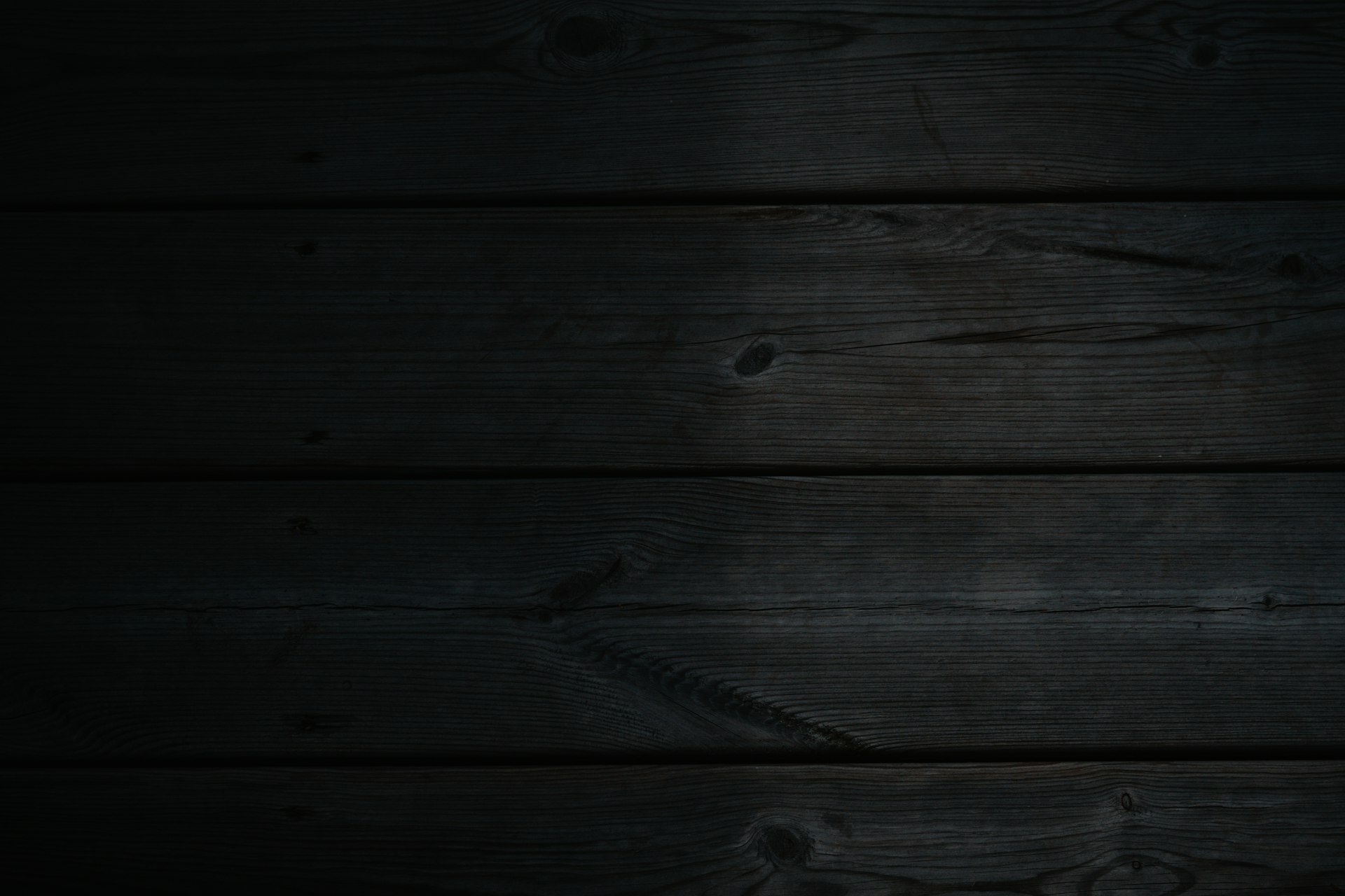 a dark wood background with a black background